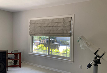 Classic bedroom with printed blackout Roman shades