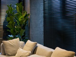 Detailed view of mini blinds adding sophistication to a room's interior.